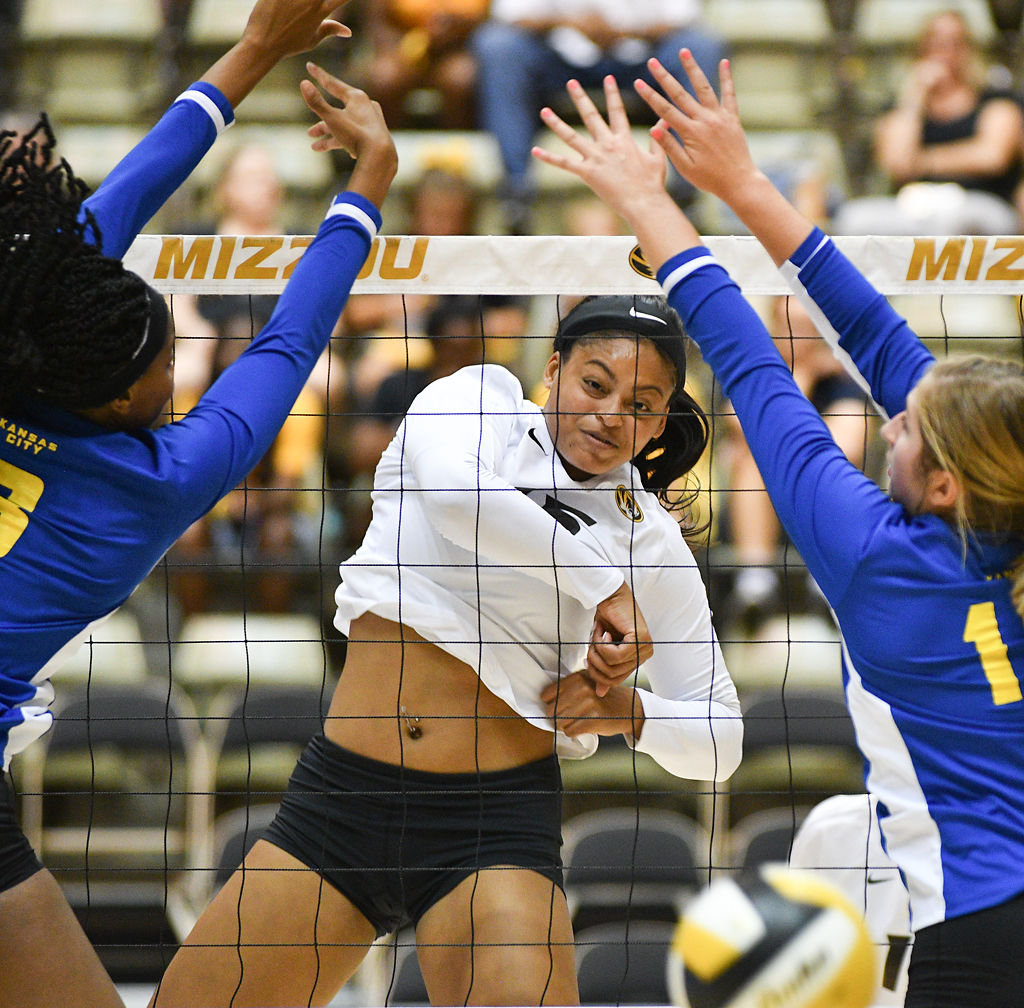Kayla Caffey spikes the ball